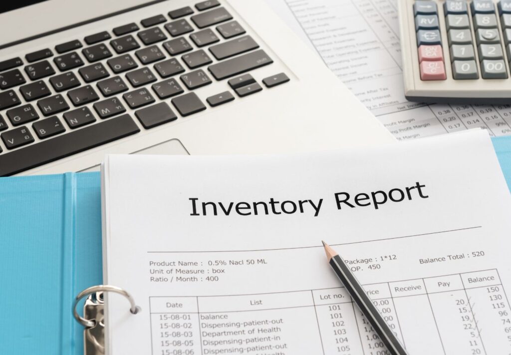 spiral notebook with "inventory report" at the top for b-stock inventory