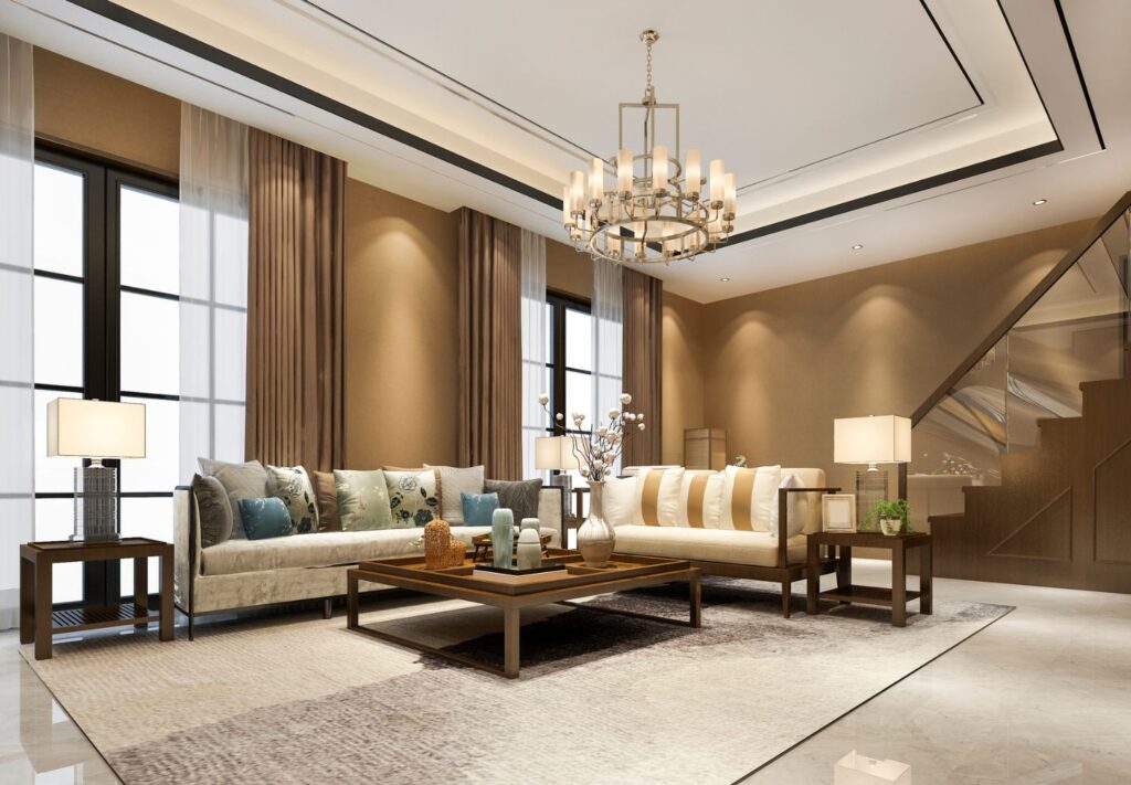 a living room with a chandelier and couches